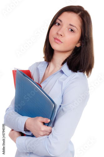 Foto: überforderte schülerin mit schulheften überforderte schülerin mit schulheften