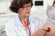Doctor examining pregnant woman