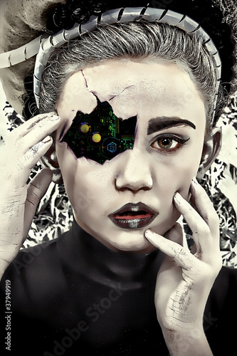 Photo: Damaged and Cracked Cyborg Robot Child with Circuits Showing Damaged and Cracked Cyborg Robot Child with Circuits Showing