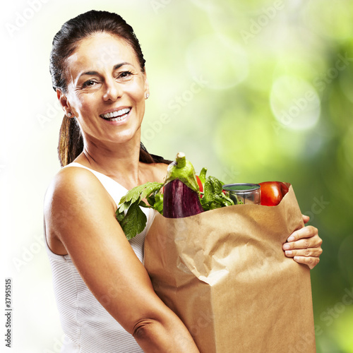 Photo: woman with a groceries bag woman with a groceries bag