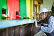 Beekeeper by an apiary observing carefully his bees