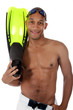 Young attractive African American man in swimsuit, happy