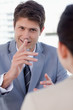 Photo: Portrait of a handsome manager interviewing a female applicant Portrait of a handsome manager interviewing a female applicant