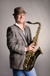 Photo: Smiling young man with a saxophone. Smiling young man with a saxophone.