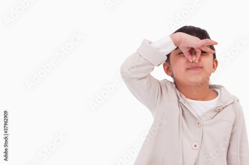 Photo: Girl pinching her nose Girl pinching her nose