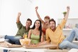 Young football fans jittering at home