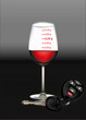Verre de vin gradué et clés de voiture
