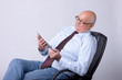 portrait of a successful senior man with tablet