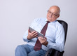 portrait of a successful senior man with tablet
