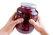 Hands holding preserved beetroot