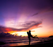 Silhouette of happy couple embracing on the beach Silhouette of happy couple embracing on the beach