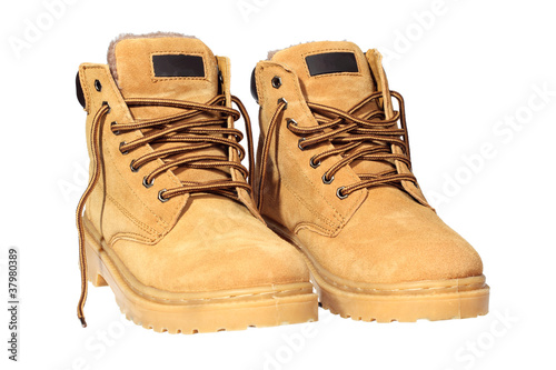 Photo: Hiking boots isolated over white with clipping path. Hiking boots isolated over white with clipping path.