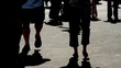 People Silhouettes Against Sidewalk People Silhouettes Against Sidewalk