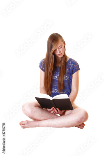 Photo: Girl reading book. Girl reading book.