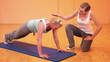 Fitness trainer giving instructions for pushups