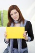young Woman with blank panel for advertising and text