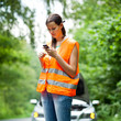 Young female driver calling the roadside service
