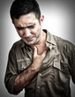 Grunge image of a man having a chest pain or heart attack