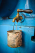 Old tap with rusty mug - water supply shortage