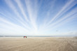 Three people on a windy beach Three people on a windy beach
