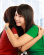 Two women hugging