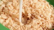 Bowl of Cereal filling with millk