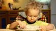 boy eats soup itself