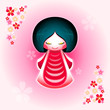 Spring japanese kokeshi doll with sakura flowers