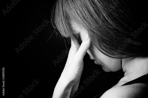 Foto: Closeup portrait of depressed teenager girl. Closeup portrait of depressed teenager girl.