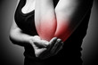 young woman having pain in her elbow