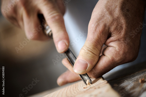 Photo: hands of a carpenter, close up hands of a carpenter, close up