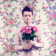 Young beautiful man with flowers