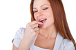 Foto: Beautiful young woman eating chocolates Beautiful young woman eating chocolates