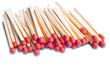 Photo: Closeup pile of matchsticks isolated on white Closeup pile of matchsticks isolated on white