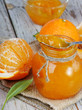 Orange jam on wooden table