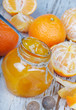 Orange jam on wooden table