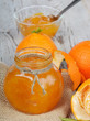Orange jam on a wooden table