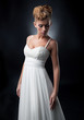 Gentle bride lovely young girl in wedding dress posing
