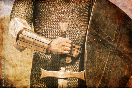 Photo: Photo of Knight and sword. Photo in old image style. Photo of Knight and sword. Photo in old image style.