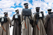 Back of soldiers with gun at historical reconstruction