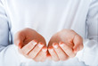 Foto: cupped empty hands in the act of presenting something cupped empty hands in the act of presenting something