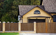 brick house and fence in an environment of vegetation and trees