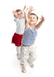 Funny boy and girl is playing in the studio