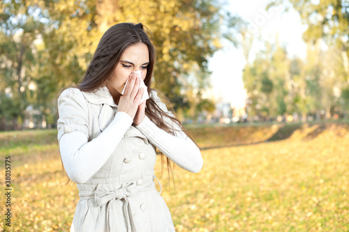 Photo: Woman blowing her nose Woman blowing her nose