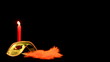 Mask  fan and candle on black background