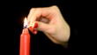 Candle is lighted on black