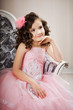 Child on a chair in a nice dress Child on a chair in a nice dress