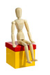 Gliederpuppe mit Geschenk bzw. Kiste
