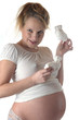 Foto: Frau schwanger hält babyschuhe Frau schwanger hält babyschuhe