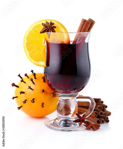 Photo: Mulled wine with spices isolated on white Mulled wine with spices isolated on white